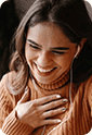 Happy woman using healthcare app on smartphone for medical support.